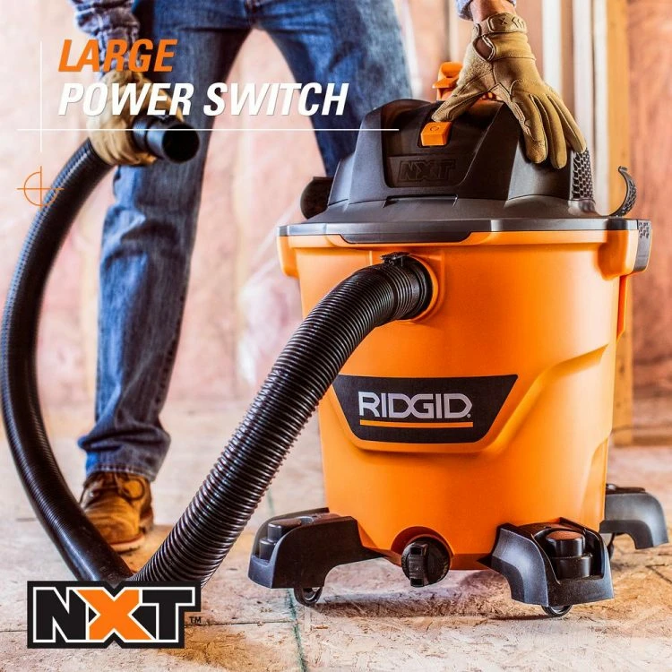 RIDGID NXT vacuum in use with large power switch.