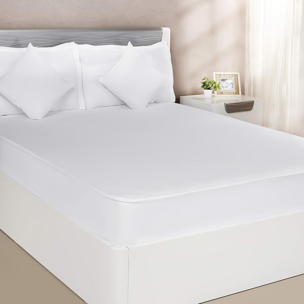 White waterproof mattress protector fitted on bed