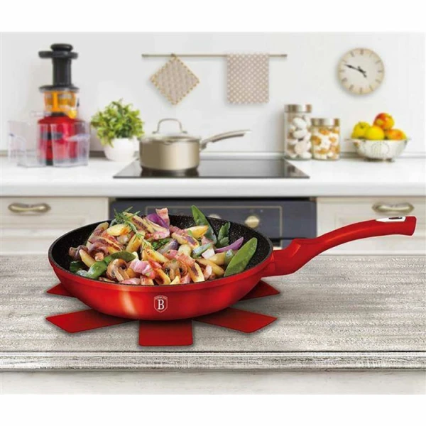 Burgundy frying pan on hob cooking healthy stir-fry