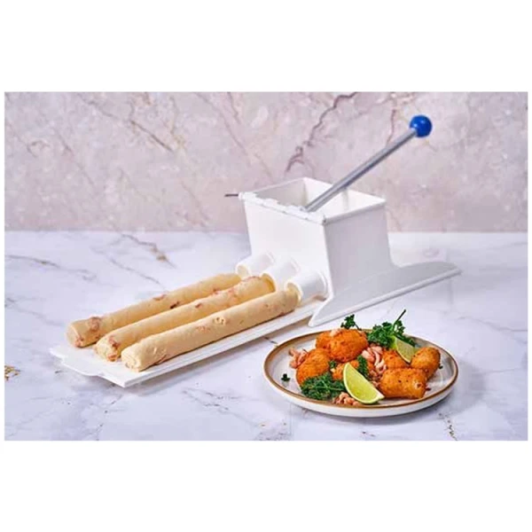 Croquette maker next to a plate of fried croquettes.