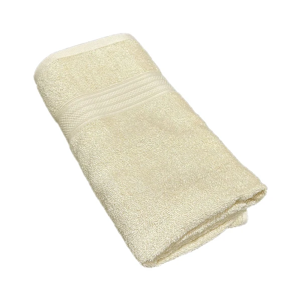 A folded, soft, ivory-colored bath towel.