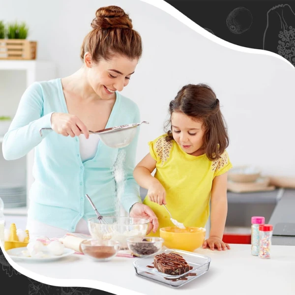  Mother and daughter baking with a glass pan.
