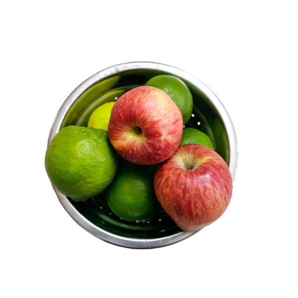 Fruit bowl filled with assorted citrus fruits and apples in a stainless steel bowl