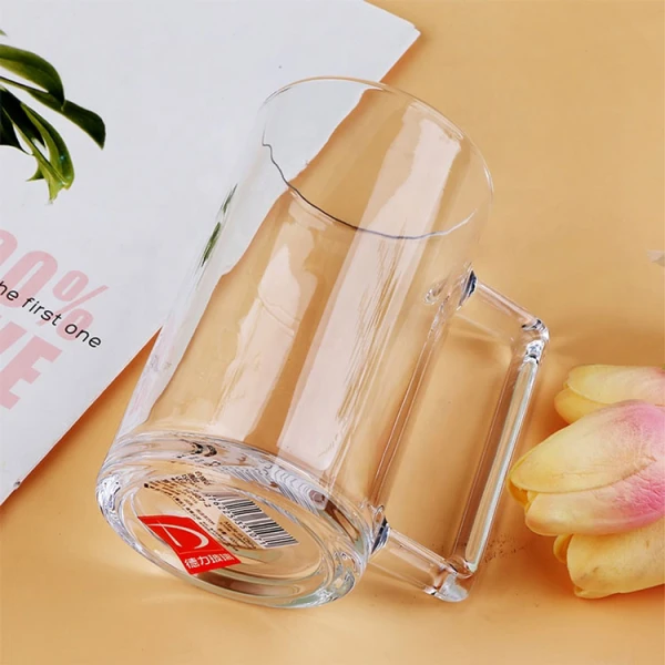 Single glass mug with handle on a book.