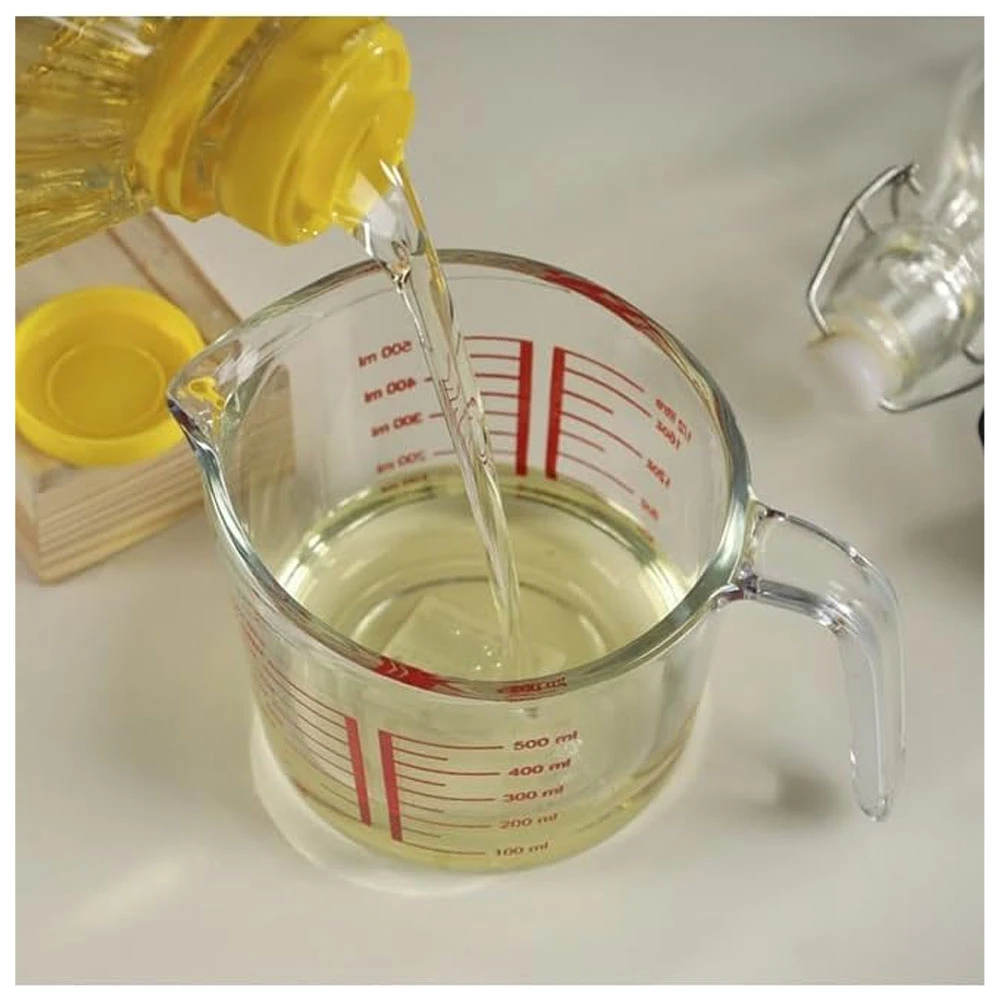 Accurate glass measuring jug with handle, holds up to 500 ml