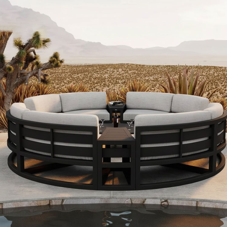 Full circular outdoor sofa, round coffee table, patio.