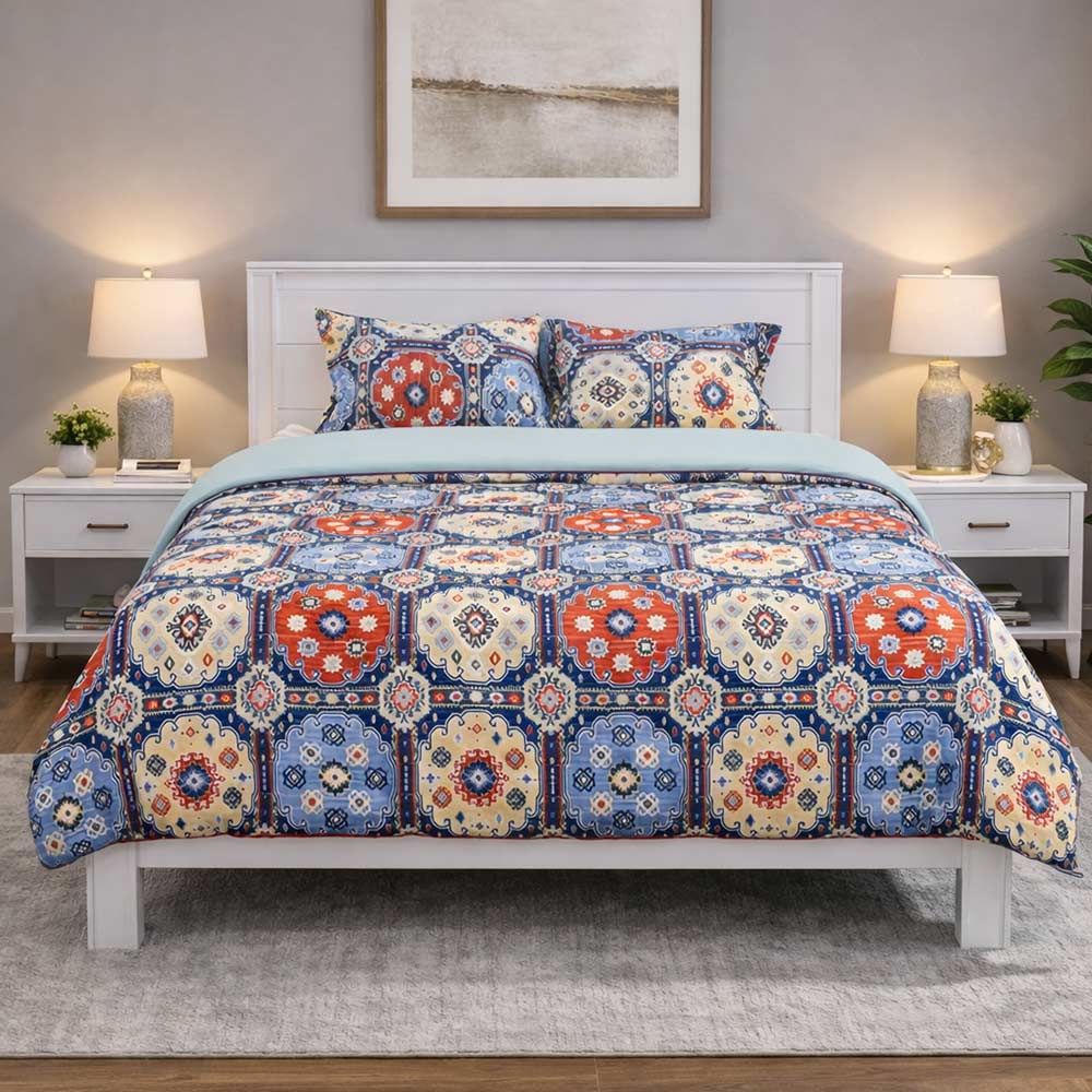 Christy’s printed king size quilt with blue accents.