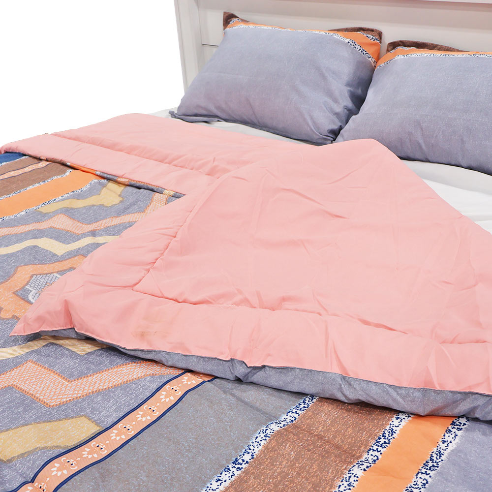 Close-up of Christy’s reversible quilt and patterned shams