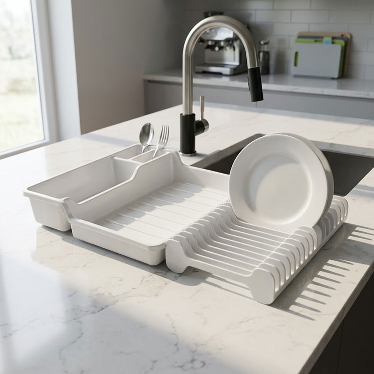 White dish rack holding plates and cutlery.