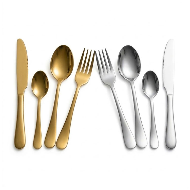 Silver and gold cutlery sets side by side