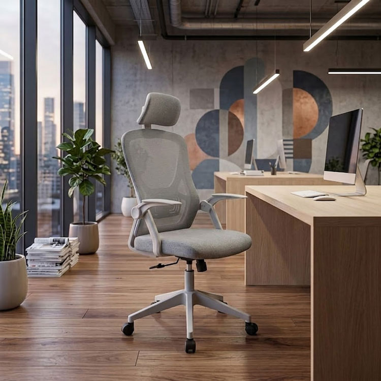 Grey ergonomic swivel office chair in modern workspace.