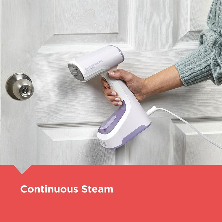 andheld steamer emitting continuous steam near a door.