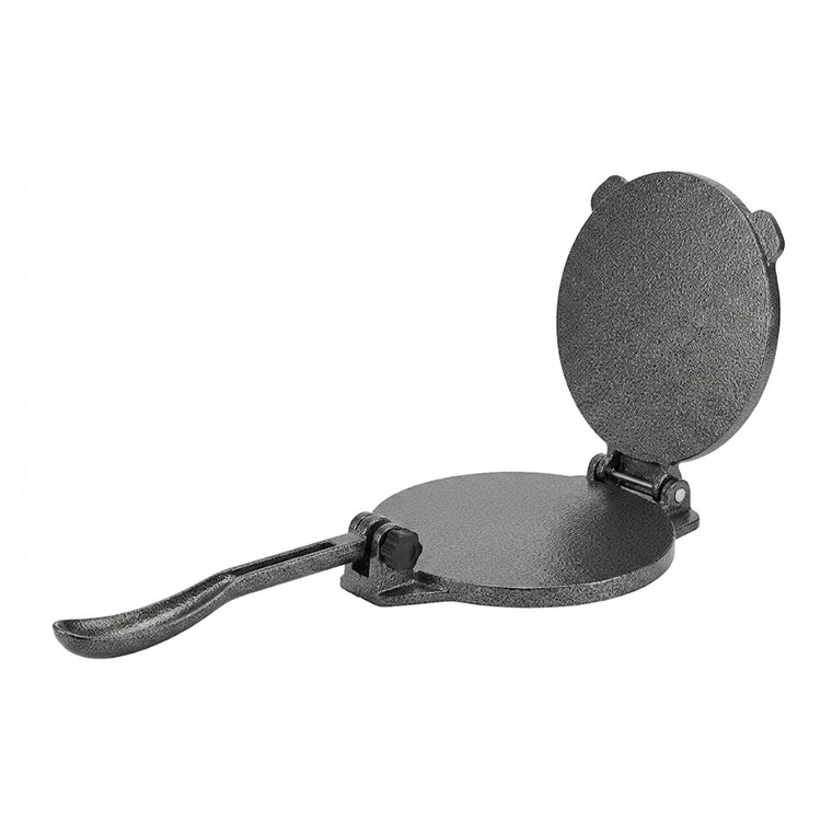 Open dual-plate cast iron tortilla press surface.