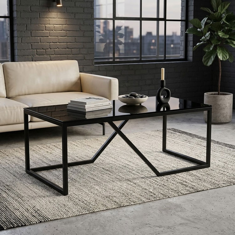 Industrial style glass coffee table on textured rug.