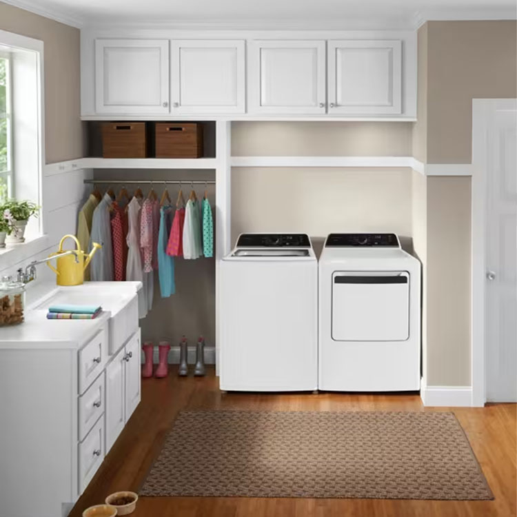 Complete laundry room with matching white washer and dryer.