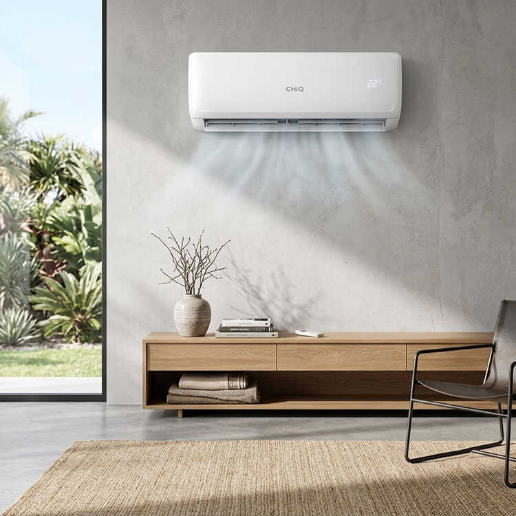 CHiQ AC unit mounted in a sunny living room.
